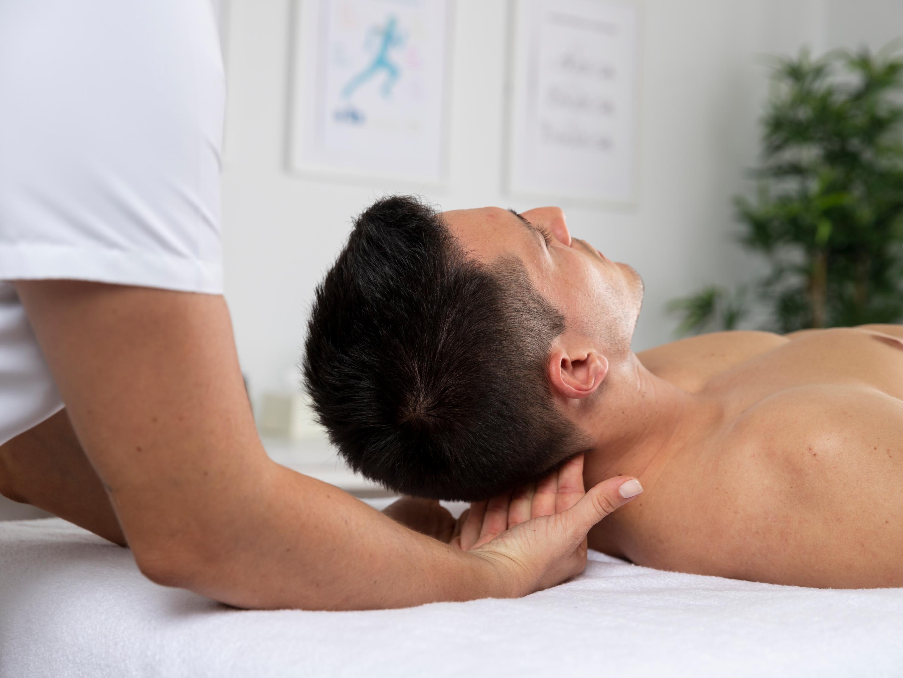 Male massaging male